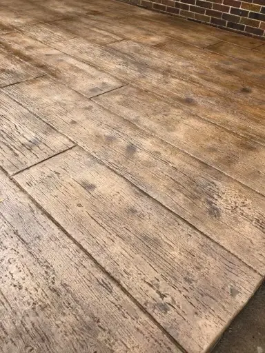 Wood-plank stamped concrete patio.