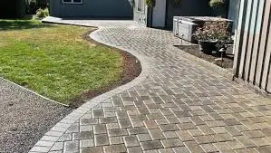 Concrete pavers in a residential walkway pattern.