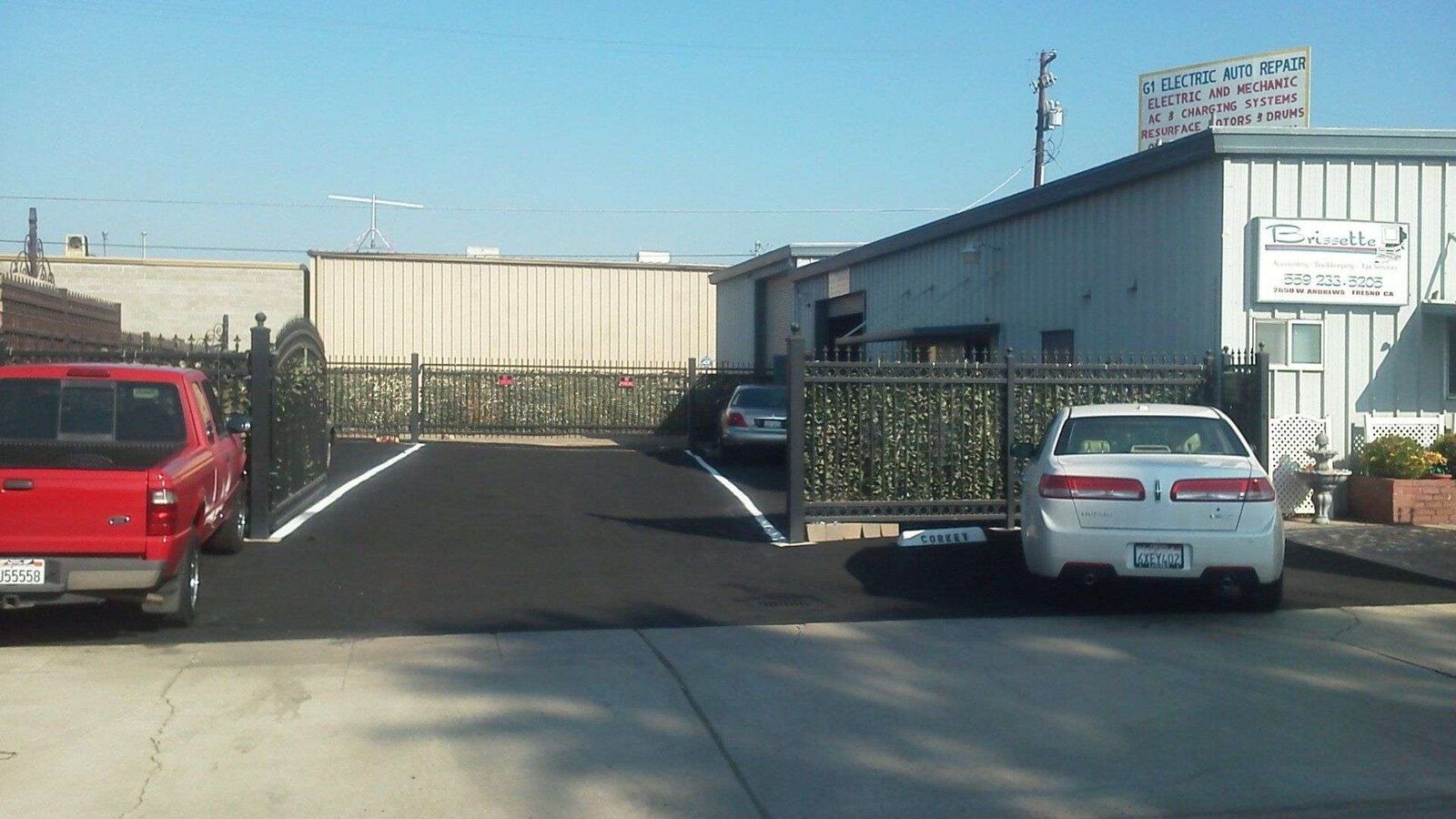 Small-business lot: sealed, striped, back in service.