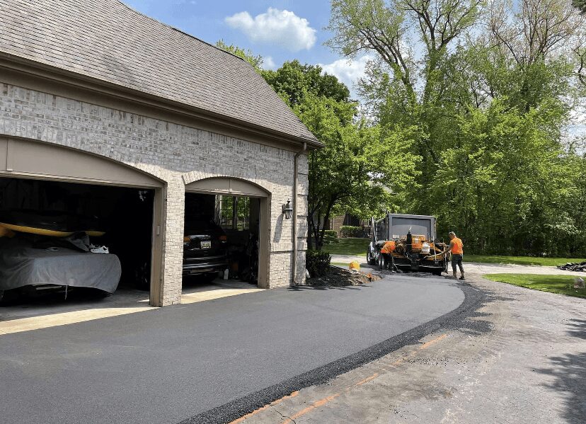 New apron meeting the garage line, edges trued by hand.